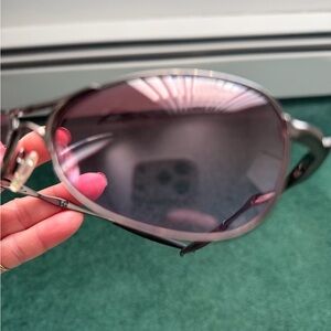Brand new sunglasses with a lavender tint and gunmetal frames and case